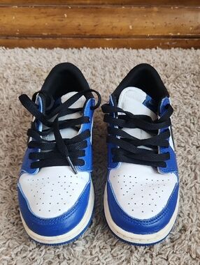 Boys Low Top Nike Air Jordans In White, Blue, And Black